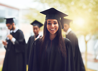 Image showing Portrait, graduation and woman with a smile, outdoor and education with qualification, certificate and success. Female person, face or student with achievement, knowledge or development with a degree