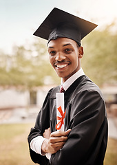 Image showing College student, portrait and black man at graduation with a diploma and smile outdoor. Male person happy to celebrate university achievement, education success and future at school event as graduate