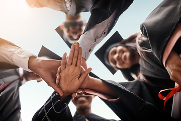 Image showing Students, graduation and group with hands stacked for college celebration outdoor. Below diversity men and women together for university achievement, education success and school graduate event