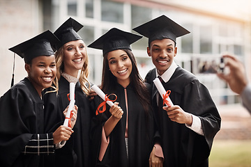 Image showing Students, graduation and diploma of a college group with a smile and pride outdoor. Diversity men and women excited to celebrate university achievement, education success and graduate memory or photo