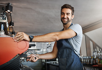 Image showing Man in cafe, machine for coffee and barista, prepare caffeine drink with process and production in hospitality industry. Service, male waiter working on espresso in restaurant and smile in portrait