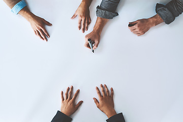 Image showing Mockup, writing and business analyst team planning company growth strategy together as teamwork or collaboration. Brainstorming, discussion and hands of corporate people in a development meeting