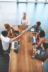 Image showing Handshake, above and business people in a meeting at work for onboarding and welcome. Happy, interview and corporate employees shaking hands for thank you, deal or partnership in a group discussion