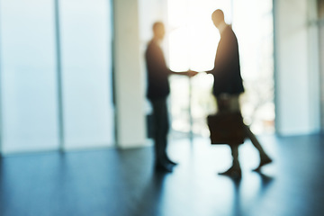 Image showing Handshake, silhouette and blur of business people in office for partnership, collaboration and agreement. Corporate, recruitment and and blurred men shaking hands for thank you, welcome and deal