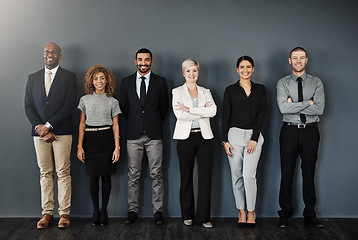 Image showing Diversity, smile and portrait of business people in studio for support, community and teamwork. Happy, collaboration and professional with employees and wall background for motivation and mission