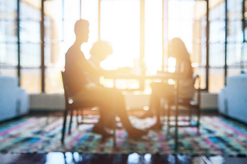 Image showing Silhouette, people in business meeting and lens flare or sunlight in modern office planning. Teamwork or collaboration, support and colleagues talking or discussing together at desk in workplace