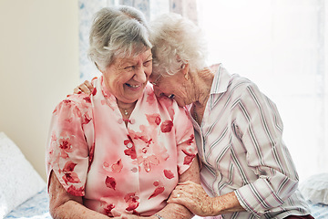 Image showing Happy, funny and senior woman friends laughing in the bedroom of a retirement home together. Smile, comedy and laughter with an elderly female pensioner and friend bonding indoor during a visit