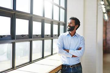 Image showing Window, thinking and a business man arms crossed in the office with a smile or vision of future success. Happy, idea and corporate with a male employee standing in the workplace during his break