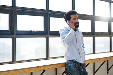 Image showing Window, phone call and a business man in the office for communication or networking with flare. Management, mobile and contact with a serious male employee standing in the workplace during his break
