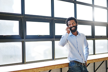 Image showing Window, phone call and thinking with a business man in the office for communication or networking. Happy, vision and idea with a happy male employee chatting in the workplace during his break