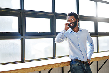 Image showing Window, phone call and smile with a business man in the office for planning, communication or negotiation. Happy, thinking and mobile networking with a male employee in the workplace during his break