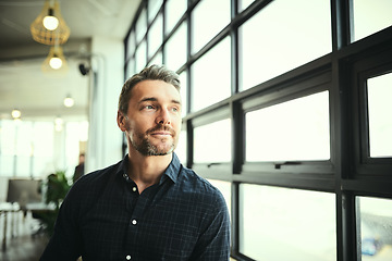 Image showing Thinking, ideas and face of man at office window, creative startup and business project for entrepreneur at design agency. Boss with creativity, job idea and focus, businessman with plan in workplace