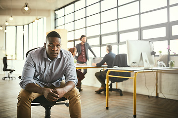 Image showing Boss, chair and portrait of black man at office, startup entrepreneur with creative ideas for business project. Leader with creativity, idea and African businessman with plan at tech design workspace