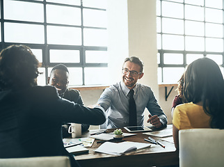 Image showing Business man, handshake and deal in a meeting with agreement and contract collaboration. Partnership, success and b2b work with shaking hands to welcome and show congratulations from teamwork