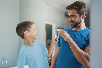 Image showing Boom. Toothbrush, brushing teeth and father with son bathroom for morning routine, bonding and dental. Oral hygiene, cleaning and smile with man and child in family home for self care and wellness.