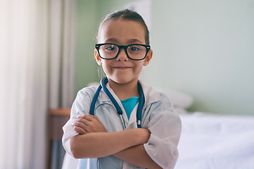 Image showing Girl child, portrait and playing doctor with smile, glasses and stethoscope in home, hospital or clinic. Female kid, play medic and happy with excited face, learning and game for development in house