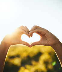 Image showing Woman with heart hands, nature and sun, sustainability and eco friendly earth care with natural farm in countryside. Conservation, sustainable farming and girl with love hand sign or kindness emoji.