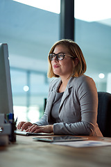 Image showing Computer, typing and business woman in office working late on project at night alone. Desktop, professional and female accountant writing email, report or planning, reading and overtime for deadline.