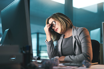 Image showing Sick, headache and business woman in office, tired or fatigue while working late at night on computer. Burnout, migraine and female person with depression, anxiety or brain fog, stress and deadline.