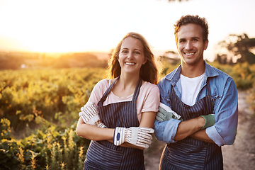 Image showing Happy couple, arms crossed and portrait at farm, outdoor agriculture for plants, food and vegetables. Woman, man and together in countryside, garden or farming with happiness, start or sustainability