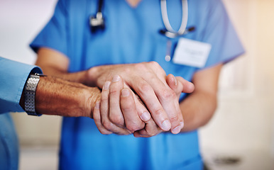 Image showing Care, support and a doctor holding hands with a man for healthcare, help and service. Caregiver, love and closeup of a nurse with a helping hand for a senior person for medical trust and nursing