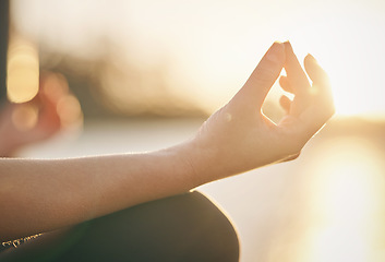 Image showing Hand, yoga and lotus pose with woman at sunrise, fitness outdoor with meditation and wellness for mental health. Sunshine, female person meditate and zen with exercise, healing and mindfulness