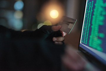 Image showing Theft, hands of a hacker with credit card with a laptop and screen of numbers. Illegal or money laundering payments, cyber security and male person stealing capital from account with online software