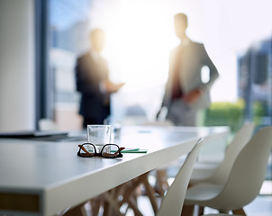 Image showing Business people, boardroom and interior for meeting, partnership or corporate discussion at conference. Businessman in team collaboration with glasses and notes on table at the office or workplace