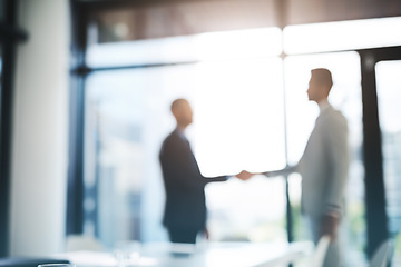 Image showing Business people, handshake and partnership for meeting, hiring or b2b deal agreement at office. Businessman shaking hands in recruiting, teamwork or collaboration with blurred background at workplace