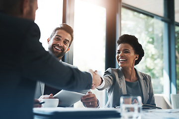 Image showing Happy business people, handshake and meeting in teamwork for partnership or collaboration in boardroom. Woman person shaking hands in team recruiting, introduction or b2b agreement at the workplace