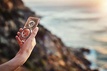 Image showing Travel, compass and hand for navigation or finding path or out for hike in summer and mountain journey on bokeh. Directions, lost and search for a route or magnetic or nature and vacation adventure