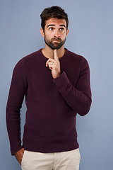 Image showing Thinking, wonder and man in studio with unsure, uncertain and thoughtful on gray background in studio. Doubt mindset, mockup space and face of male person thoughtful for decision, choice and question