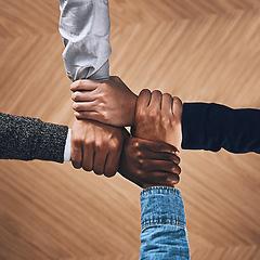 Image showing Collaboration, link or hands of business people with diversity for community support or teamwork in office. Zoom, above or group of employees with joint mission, trust or hope for goals together