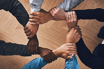 Image showing Solidarity, holding or hands of business people with diversity for group support or teamwork in office. Community, link or above group of employees with mission or team building for goals together