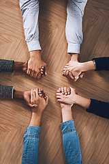 Image showing Above, diversity or business people holding hands for support, team building or teamwork in office. Partnership, zoom or employees in group collaboration with solidarity or mission for goals together