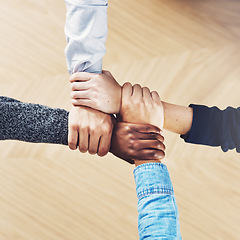 Image showing Teamwork, link or hands of business people with diversity for community support or strategy in startup office. Zoom, above or employees in group collaboration or mission with hope for goals together