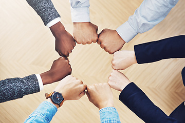 Image showing Teamwork, fist bump or hands of business people together for motivation, group support or community. Collaboration, team building or above of circle fists for diversity, trust or office partnership