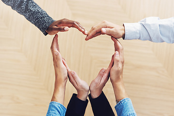 Image showing Teamwork, heart or hands of business people in support for trust, diversity or community inclusion in office. Love gesture, above or employees in group collaboration with hope or kindness for charity