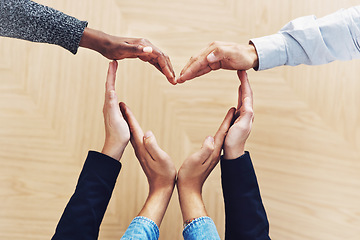 Image showing Community, heart or hands of business people in support for trust, teamwork or diversity inclusion in office. Love gesture, above or employees in group collaboration with hope or kindness for charity