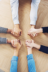 Image showing Above, solidarity or business people holding hands for support, team building or teamwork in office. Partnership, zoom or employees in group collaboration with diversity or mission for goals together