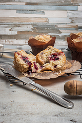 Image showing Muffins with red fruits jam fill.