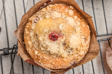 Image showing Muffins with red fruits jam fill.