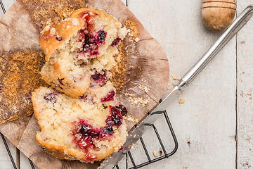 Image showing Muffins with red fruits jam fill.