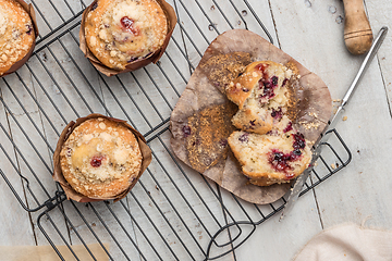 Image showing Muffins with red fruits jam fill.