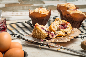 Image showing Muffins with red fruits jam fill.