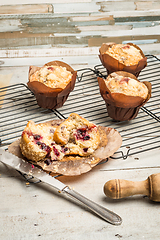 Image showing Muffins with red fruits jam fill.