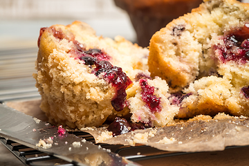 Image showing Muffins with red fruits jam fill.