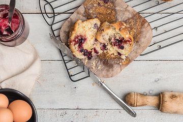 Image showing Muffins with red fruits jam fill.