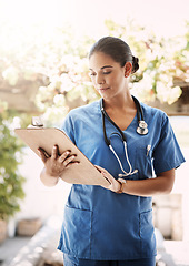 Image showing Woman doctor, clipboard and check documents for medical service, hospital paperwork and nursing registration or information. Report, analysis and professional nurse or healthcare person and checklist