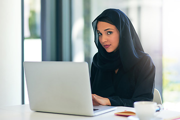 Image showing Muslim, portrait and businesswoman working on a laptop for a career in dubai for a company. Woman, arab and professional is an entrepreneur on a computer for web design on a website for a job.